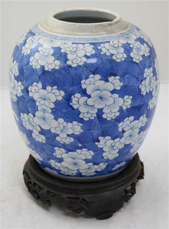 A Chinese blue and white ovoid jar, 18th century, height 21.5cm, wood stand